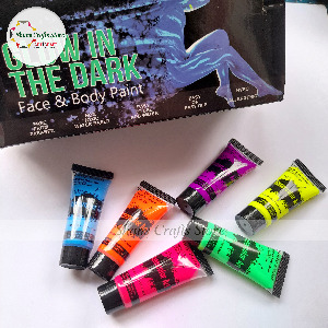 Six tubes of glow in the dark body paint in various colors including pink