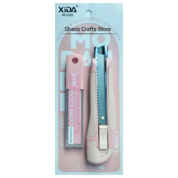 Cutter cutter with replacement blades in pink packaging.